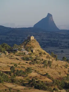 Prints of ethiopian culture, christian, orthodoxy, orthodox, oriental orthodox, eastern christian, tewahedo, miaphysite, miaphysitism, church exterior, hilltop, countryside, alone, evening, abba pantelewon Travel Destination Prints: View on Abba Pentalewon church in vicinity of Aksum city in Ethiopia