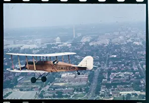 View of Airplane Flying Over Landscape