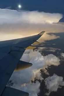 View from a Boeing 747-400 of a storm front at full moon, Australia