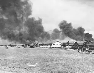 Prints of (Original Caption). Smoke roils over Pearl Harbor and the officer's quarters at Hickam Field during the Japanese attack on December 7, 1941 Pearl Harbor Prints: View of Burning Area on Hickam Field During Pearl Harbor Attack