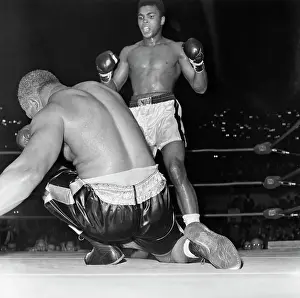 View of Cassius Clay Knocking Out Archie Moore
