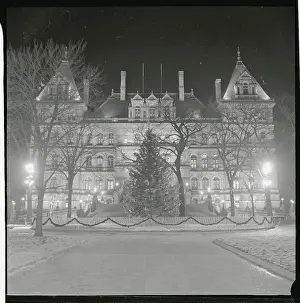 Prints of (Original Caption). The State Capitol in Albany is ablaze with lights, which silhouettes the 50-foot Christmas tree in Capitol Park A Timeless Christmas: Vintage Treasures: View of Christmas Tree Outside State Capitol Building