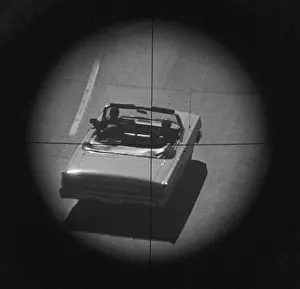 Assassination Prints: View of Convertible Through Gunsight