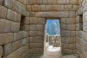 View though a doorway of a typical Incan wall, UNESCO World Heritage Site, Machu Picchu, Peru
