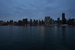 East River Collection: View of East River and midtown Manhattan at night