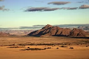 Harry Laub Travel Photography Gallery: View from Elim Dune onto grass steppe, Sesriem Camp and Tsaris Mountains, Namib Desert