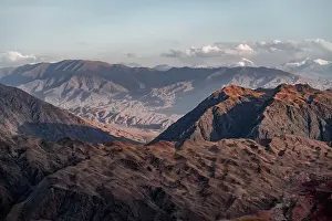 Erosion Prints: View over eroded mountainous landscape of Konorchek Canyon with red sandstone rocks