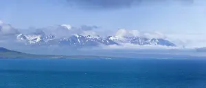 Bergen Prints: View across the Eyjafoerdur to the snow-capped mountains near Dalvik
