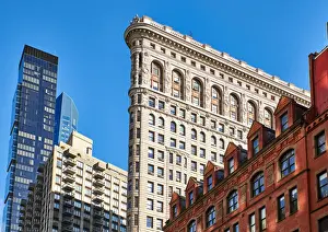 Side view of the Flatiron Building with surrounding buildings in the background against