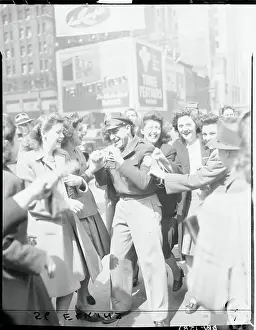 View of Jubilant Crowd in Street