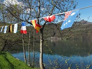 Images Dated 14th April 2016: View Of Lake Orta With International Flags In The Foreground