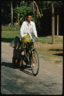 Java Prints: View of a Local Indonesian Inhabitant Riding Bicycle