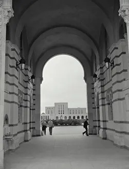 Pathway Prints: View looking through arch of Administration building of Rice Institute with Library in background at Houston Texas