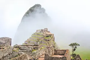 Machu Picchu Incan Ruins Prints: View of Machu Picchu at dawn with fog, Peru