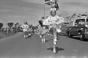 Front View of Majorettes Marching Ahead of Band