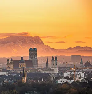 Prints of View over Munich with Church of Our Lady, Theatine Church, Ludwigskirche, behind Zugspitze at sunset, Munich, Bavaria, Germany ImageBROKER Collection Prints: View over Munich with Church of Our Lady