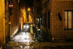 Raindrop Gallery: View on night city street in Old Town of Bologna during the heavy rain. Emilia-Romagna, Italy