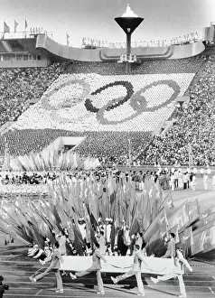 Prints of (Original Caption). The Olympic flag is carried out of the Lenin Stadium at the closing ceremony of the 1980 Olympic Games here 8/3 Capturing Glory: A Journey Through Olympic History: View of Olympic Games Closing Ceremony