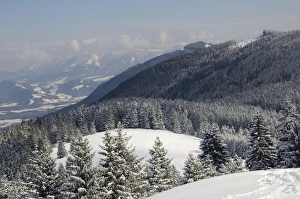 Images Dated 9th February 2013: View from the peak of Mt Schwarzenberg to a snow-covered alpine upland and the Chiemgau Alps