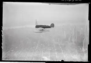 View of Plane Flying over New York City