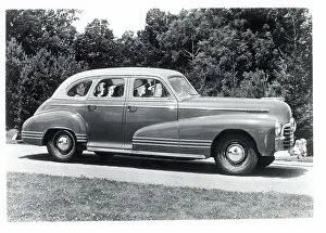 Pontiac Prints: Side View of Pontiac Four-Door on Road