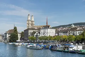 View from Quaibruecke bridge over the Limmat river to the marina with the Limmat quay, the twin towers of the Grossmuenster church at back, Zurich, Canton of Zurich, Switzerland, Europe