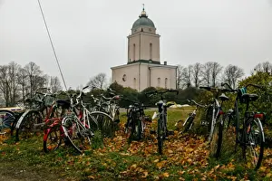 Bicycle Prints: View on Suomenlinna Church with parked bicycles on a foreground, Finland