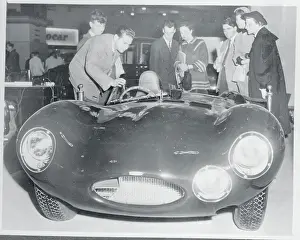 Viewers Examining Sports Car