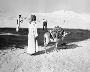 Saudi Arabia Prints: Villager Watching a Golf Game