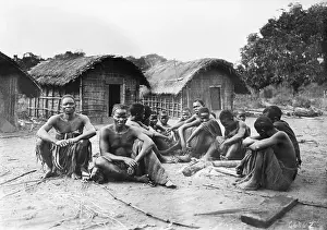 Congolese Prints: Villagers Sit Together in Front of Homes