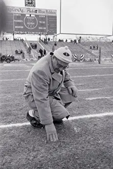 Vince Lombardi Inspecting Turf