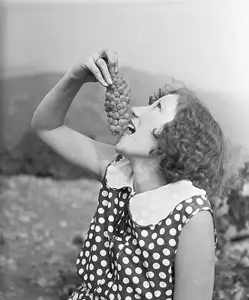 Socialite Prints: Vineyard Festival Participant Eating Grapes