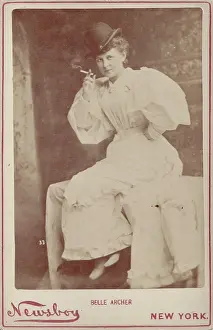 Vintage cabinet card portrait of actress Belle Archer smoking a cigarette, ca 1885