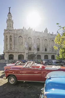 Buena Vista Images Collection: Vintage cars in front of Havana?s National Theater