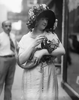 Strange Prints: Vintage photograph of pre-teen girl (10-12) carrying monkey