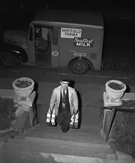 Delivery Prints: Vintage photograph showing milkman at work