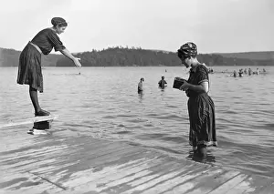 Vintage photograph showing woman bathing in lake