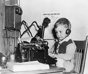 6 7 Years Prints: Vintage photograph showing young boy (6-7) p-laying receptionist