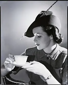 Photographers Model Prints: Vintage photograph of young woman holding cup of coffee