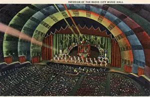 Prints of Vintage colorized historic souvenir photo postcard published circa 1942 depicting the vibrant midtown and downtown skyscrapers of New York City illuminated at night Where New York’s brightest moments take center stage: Vintage souvenir postcard, Radio City Music Hall, NYC, New York, ca 1942