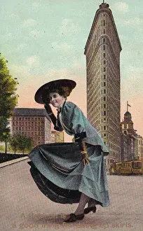 Dramatic Looking Flatiron Building Prints: Vintage souvenir postcard, Woman before Flatiron Building, 1909