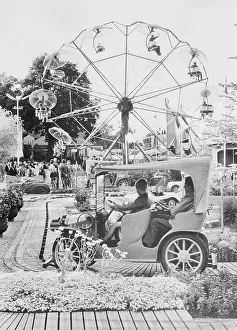 Visitors Enjoying Amusement Park