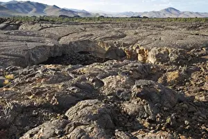 Volcanic Landscape And Cave Opening