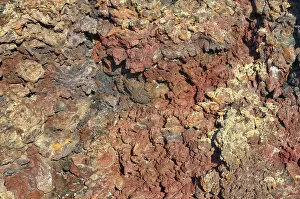 Volcanic rock, coloured by metallic oxides, Crates of the Moon National Monument, Arco, Highway 20, Idaho, USA
