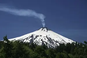 Volcanic smoke rising from Villarrica or Rucapillan Volcano, seen from Pucon, Chile