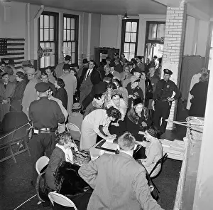Voting Officials Assisting Voters at Polling Place