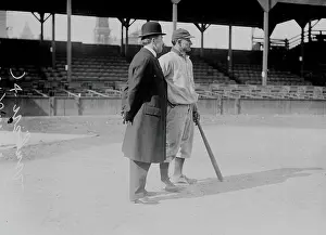Prints of American baseball player Honus Wagner (1874 - 1955) (right) of the Pittsburgh Pirates stands with a man identified as Dr. C. W. Harrison on the field at West Side Grounds, Chicago, Illinois, 1909 MLB Legends Art Prints: Top 10 Greatest Baseball Players of All Time: Wagner & Harrison At West Side Grounds