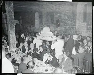 Waiters Carrying Snail Shaped Cake