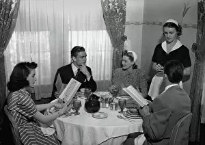 30 39 Years Collection: Waitress taking two couples order, (B&W)