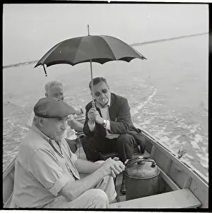 Walker Evans Prints: Walker Evans Holding Umbrella in a Boat